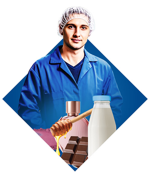 A production worker wearing hygienic protective gear